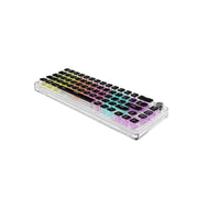A transparent mechanical keyboard with multicolored pudding keycaps and a rotary knob, featuring a 67-key layout in English and Arabic.