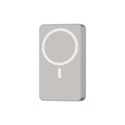 A rectangular power bank with a MagSafe circle on the front and a visible USB-C port. The color is gray or titanium, and the design is compact and modern.