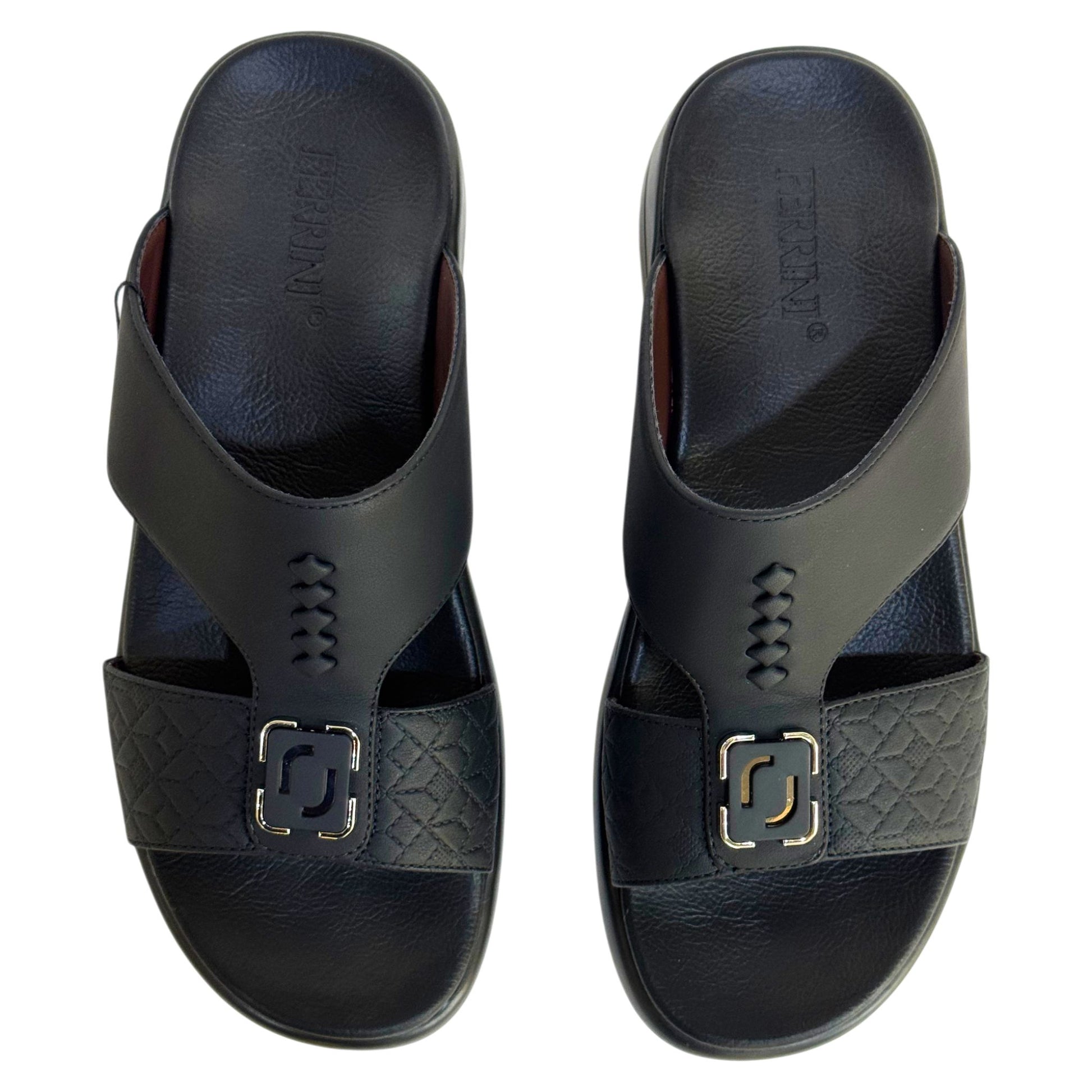 Pair of black sandals with a decorative buckle on a white background